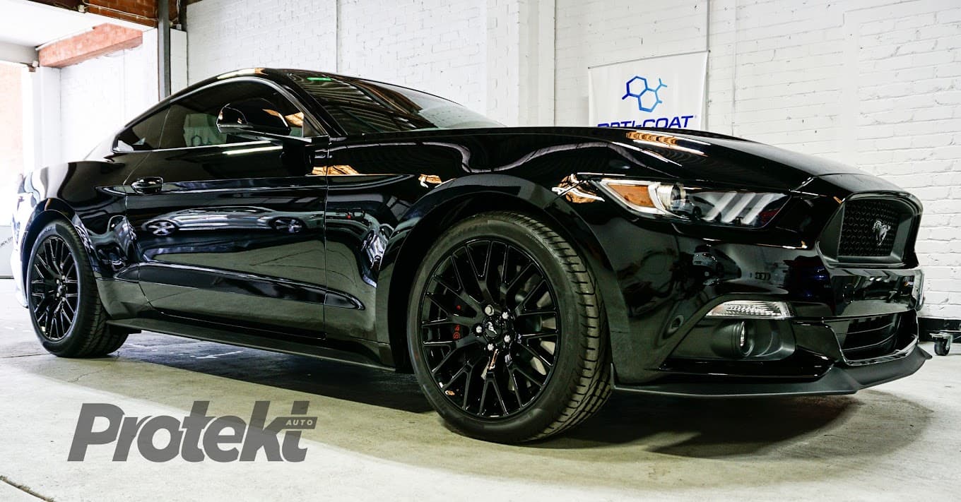 Black Ford Mustang with professional window tinting