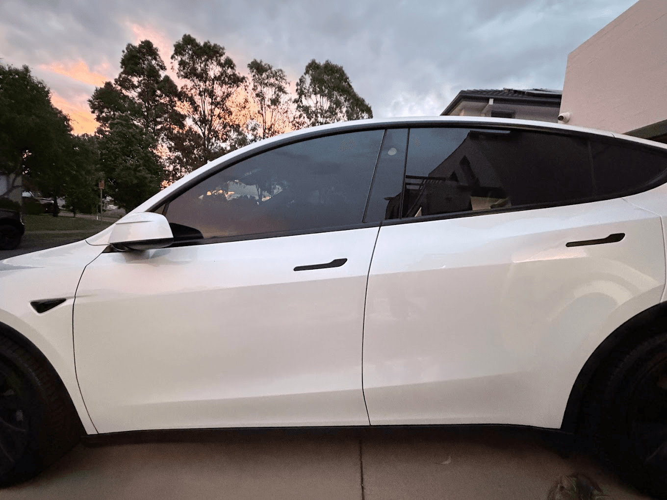 White Tesla Model Y with tinted windows